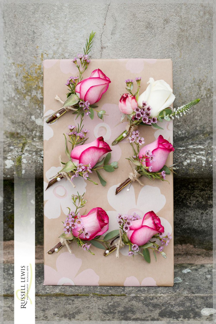 pink and ivory rose buttonholes