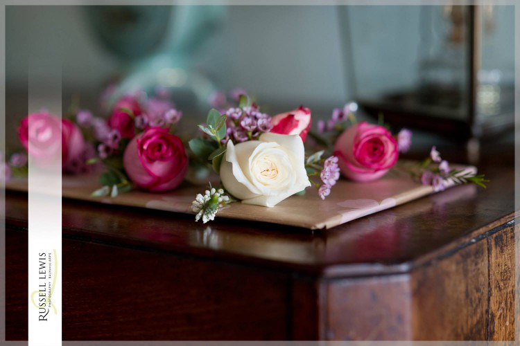 raspberry pink and ivory rose buttonhole