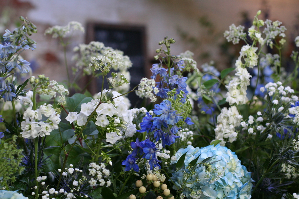 blue and white wedding flowers for a yurt wedding